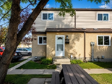 3-BEDROOM TOWNHOUSE • PRIVATE FENCED YARD • 2 PARKING STALLS
