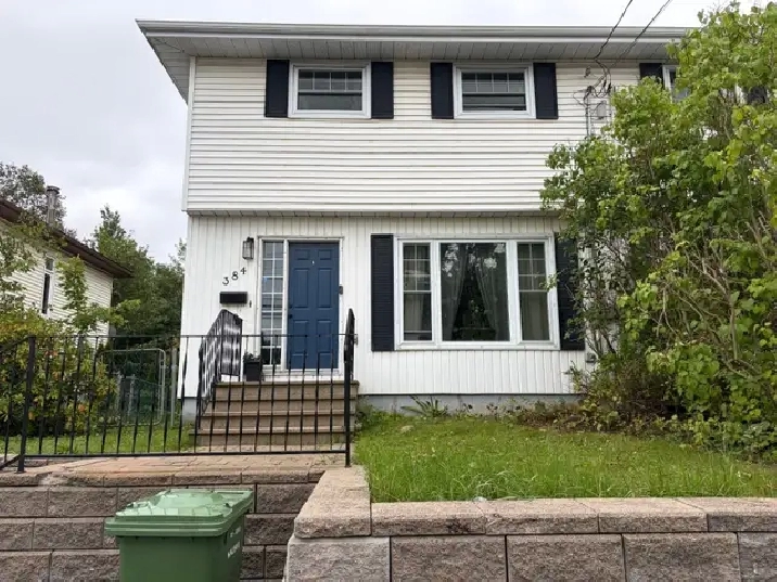 Spacious 3-bedroom duplex with yard, deck and driveway parking